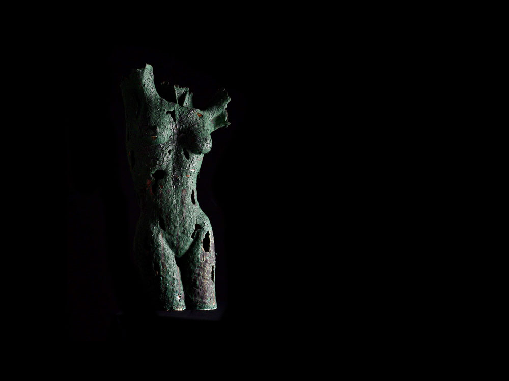 Clay on Ceramic dipped repeatedly in a verdigris glaze 